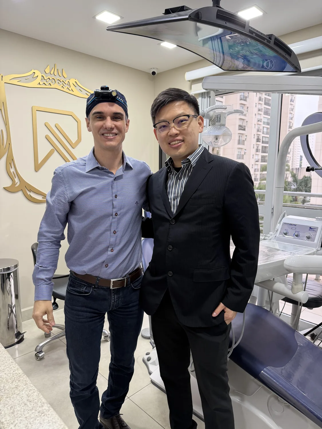Dr Sin Yong with Dr Rogerio Marques in his treatment room, Sao Paulo