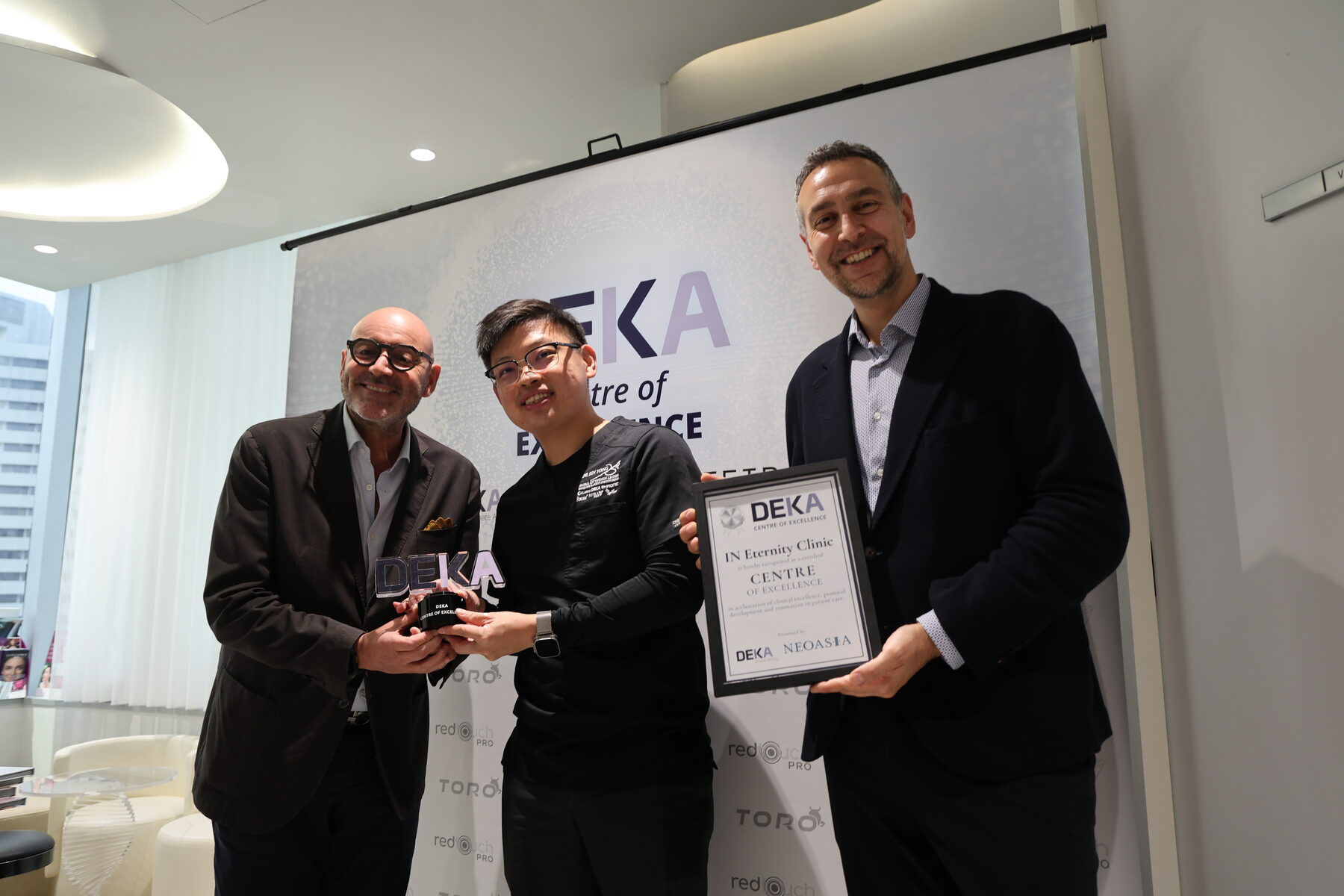 The DEKA Centre of Excellence certification presented to Dr Sin Yong by DEKA and NeoAsia representatives