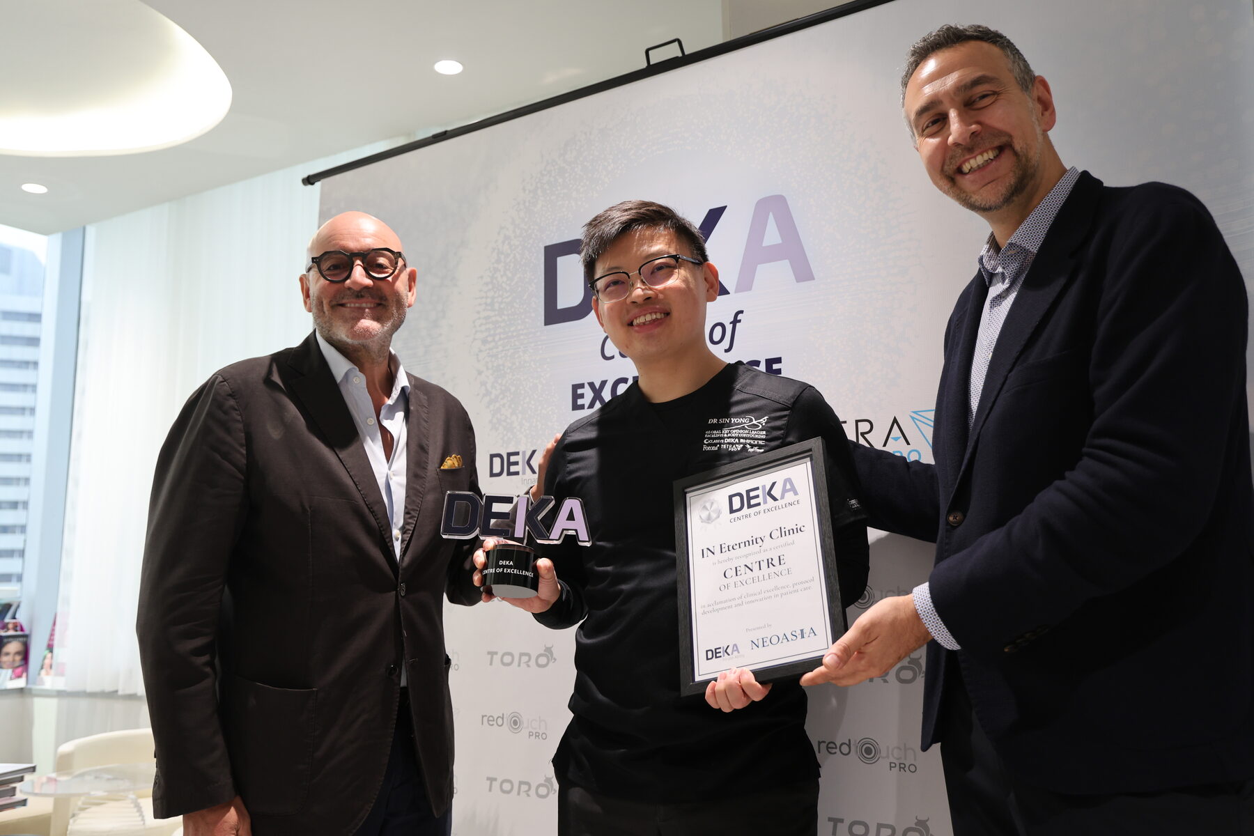 Dr Sin Yong receiving the DEKA Centre of Excellence certification from representatives of DEKA and NeoAsia, Singapore, July 2026