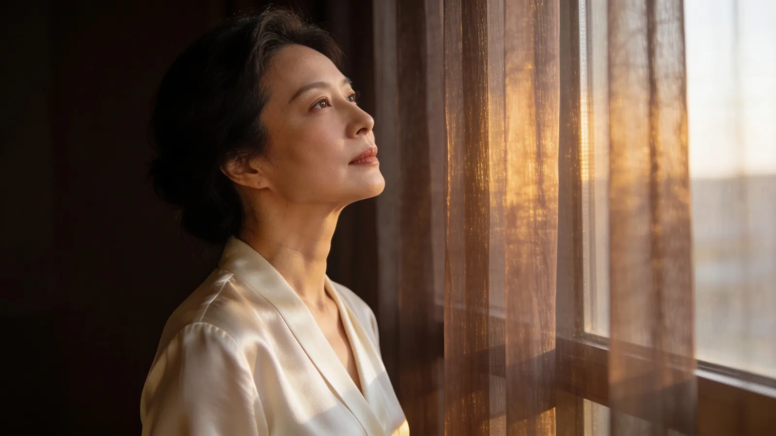 An East Asian woman in her 40s in side profile — illustrative image