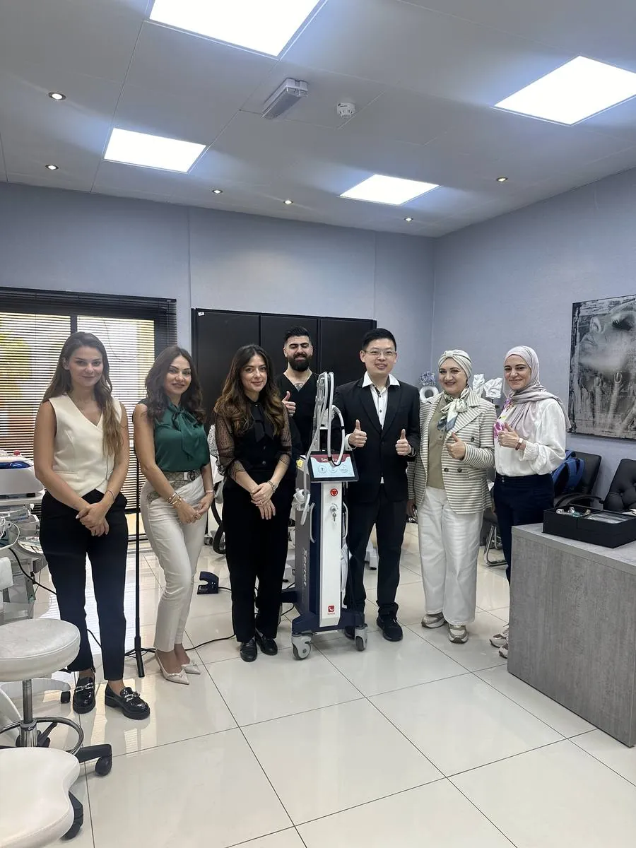 Dr Sin Yong group photo with attending physicians at Dubai clinic during ilooda KOL training — Secret RF device visible